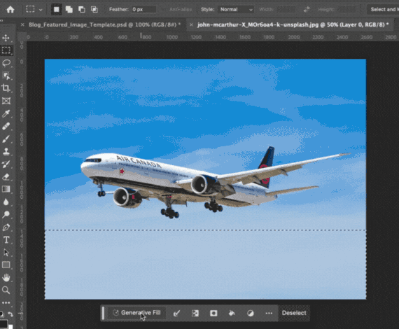 Using Photoshop's generative fill feature to add a mountain range to an image of an airplane flying in a clear blue sky
